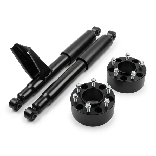 Pair of black shock absorbers with a black leveling kit